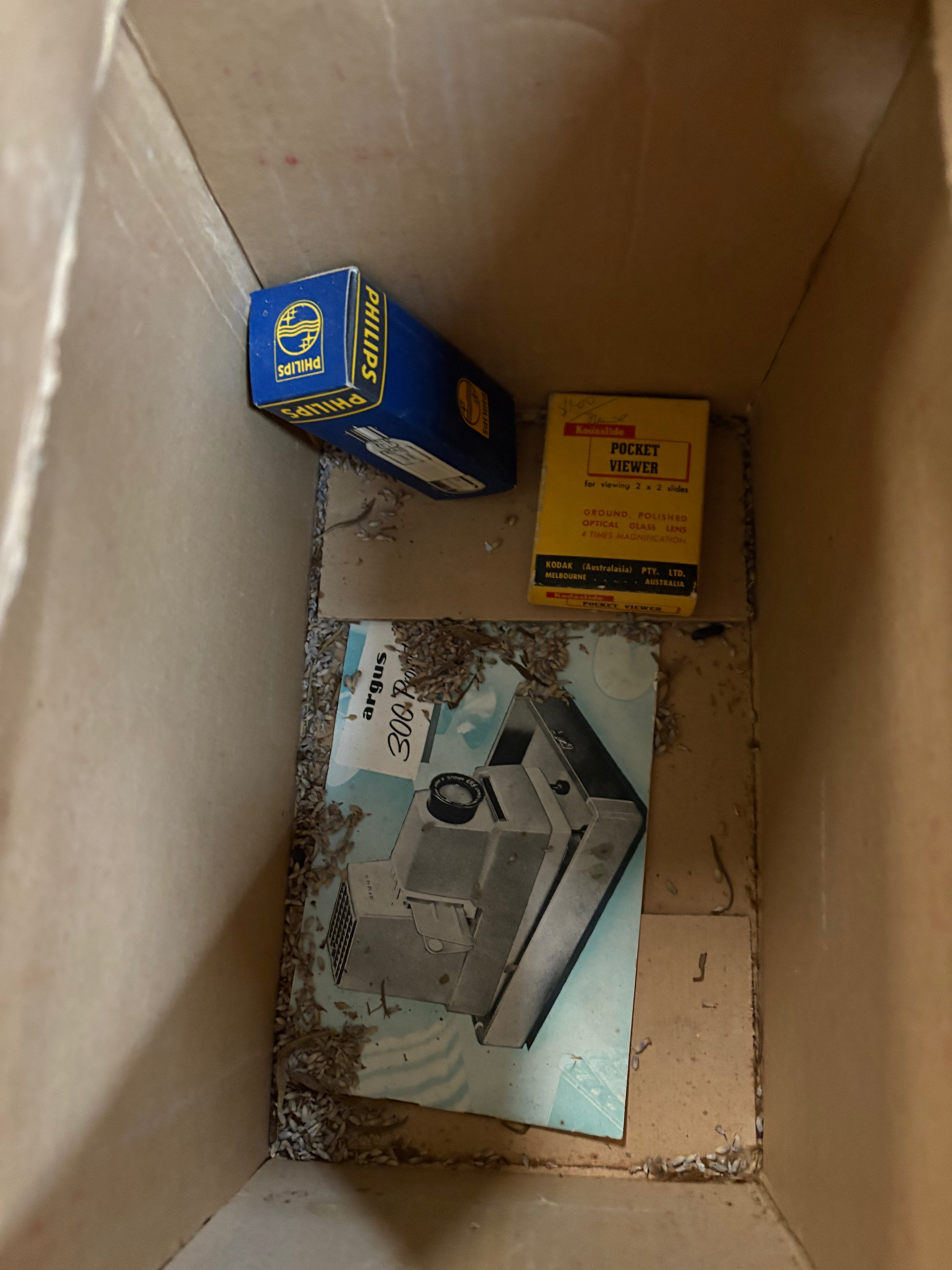 Antique slide projector in box with original manual